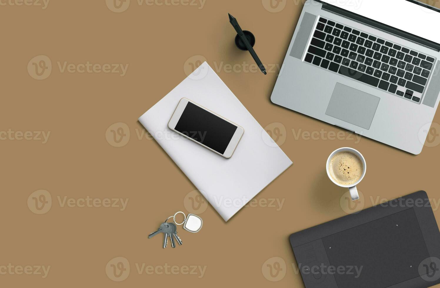 Office desk table with laptop computer, smartphone with black screen over a notebook and cup of coffee. Top view. photo
