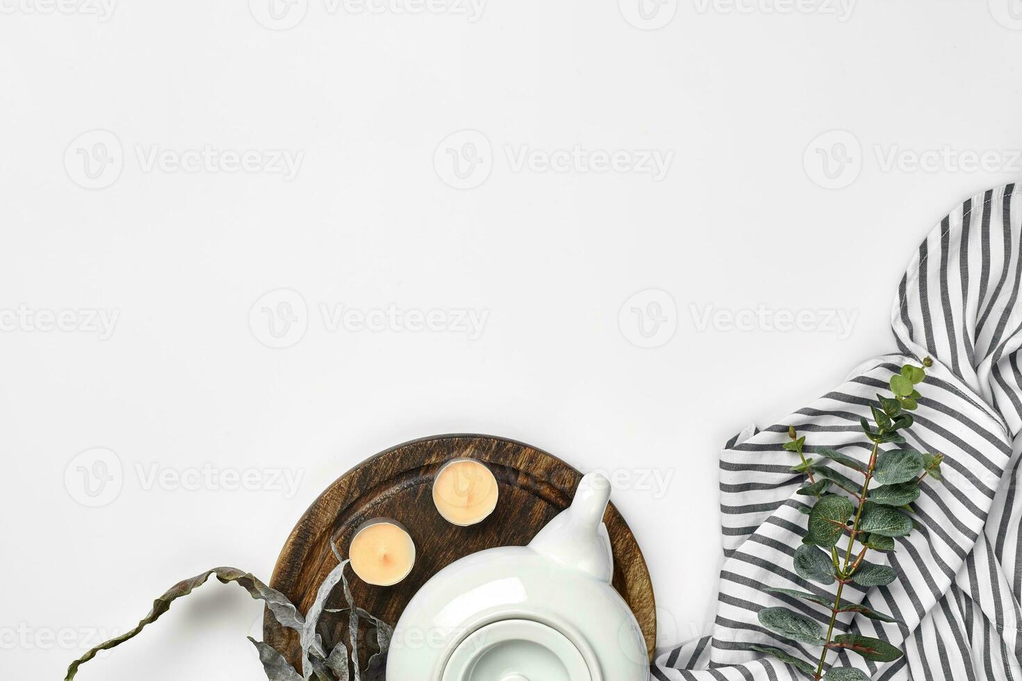 Still life with tea cup and the contents of a workspace composed. Different objects on white table. Flat lay photo