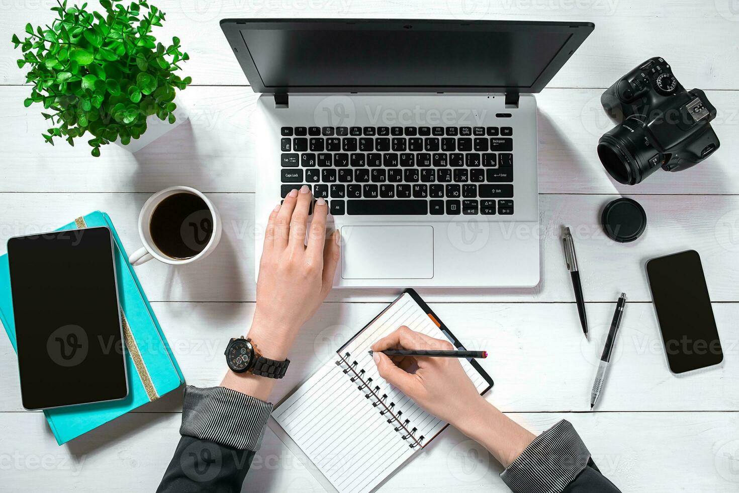 Overhead view of businesswoman working at computer in office photo