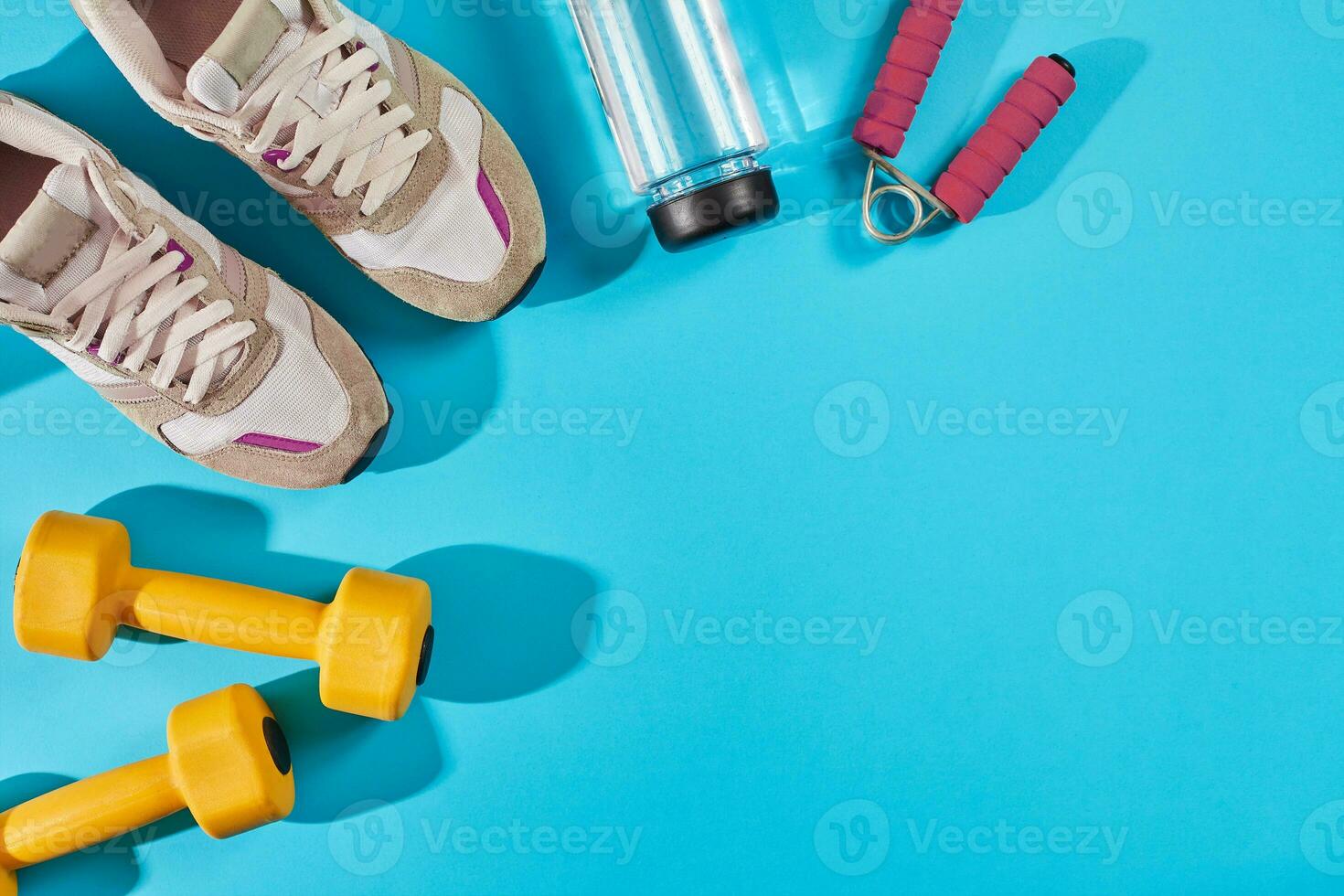 Female sport shoes and equipment top view, copy space. Active lifestyle, body care concept. photo