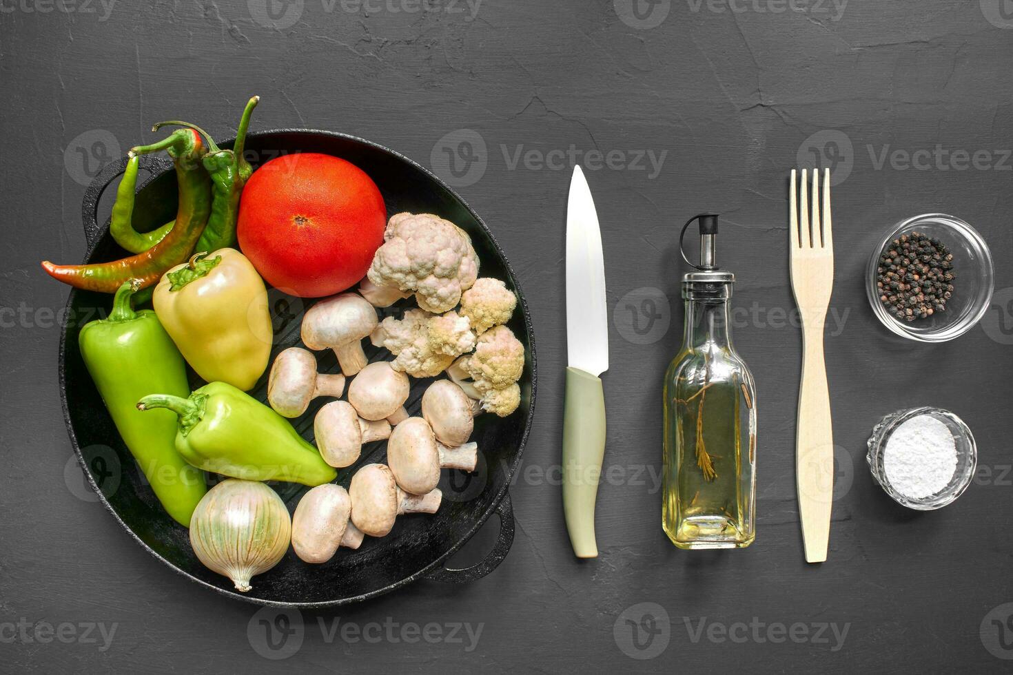 Top view of a fresh vegetables for healthy nutrition. Black background with copyspace. photo
