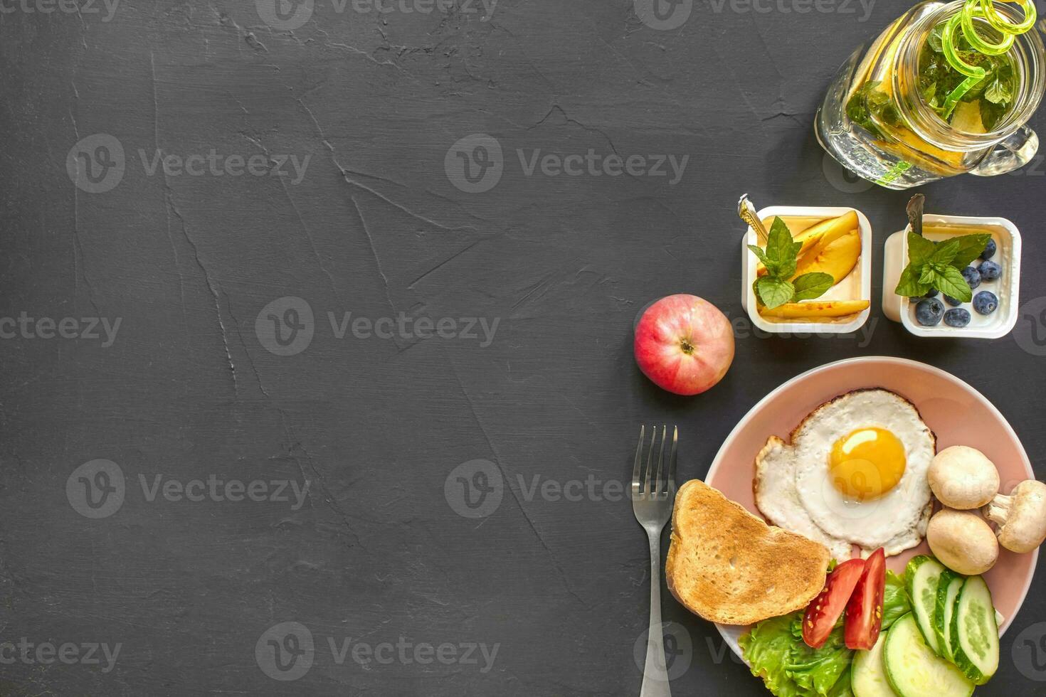 Top view of healthy and delicious breakfast on a black background with copyspace. photo