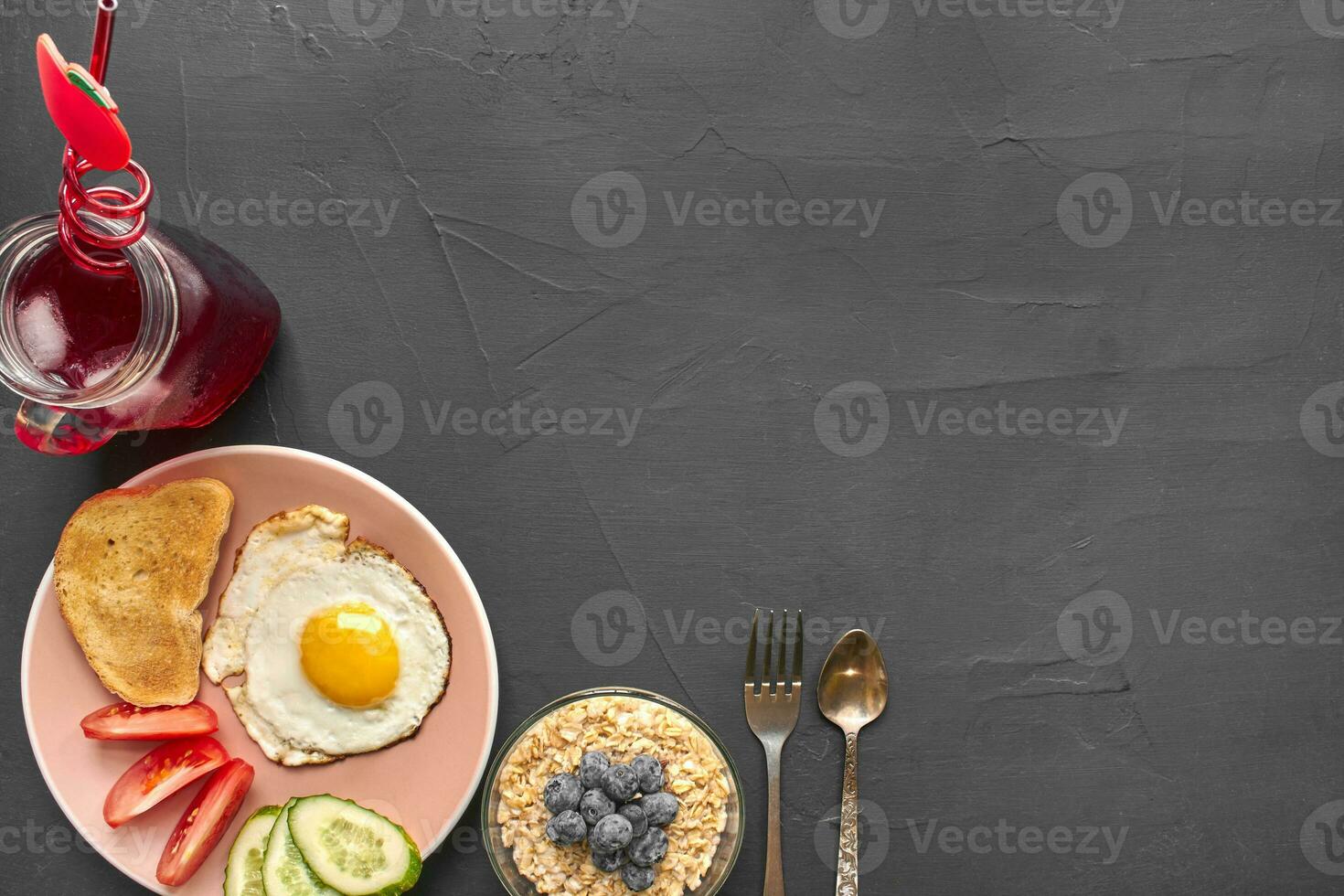 Top view of healthy and delicious breakfast on a black background with copyspace. photo