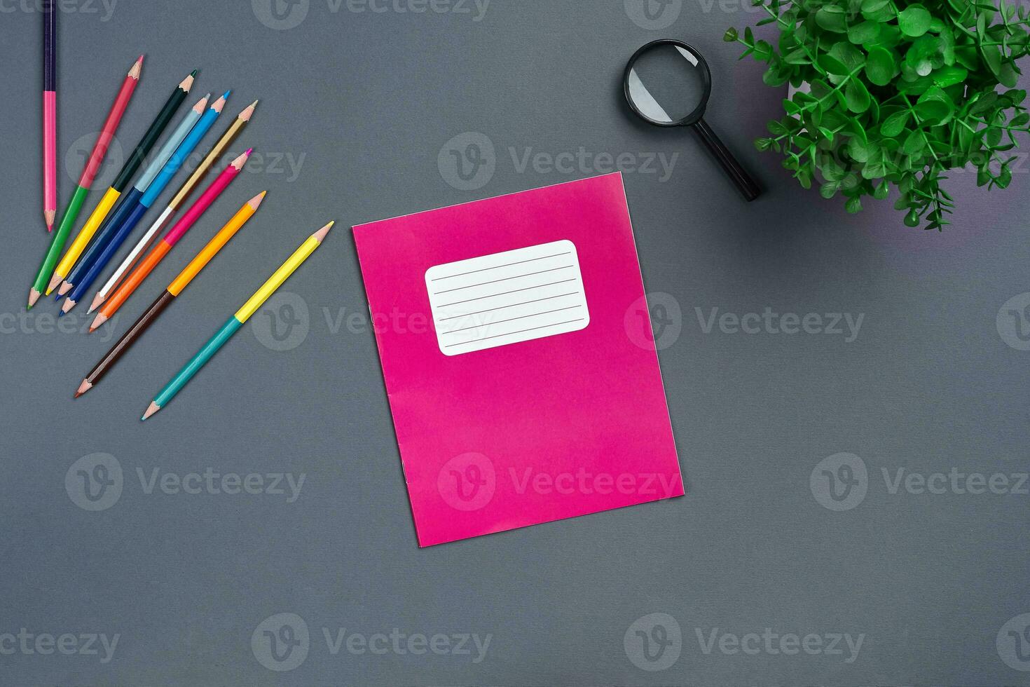 Flat lay photo of workspace desk with school accessories or office supplies.