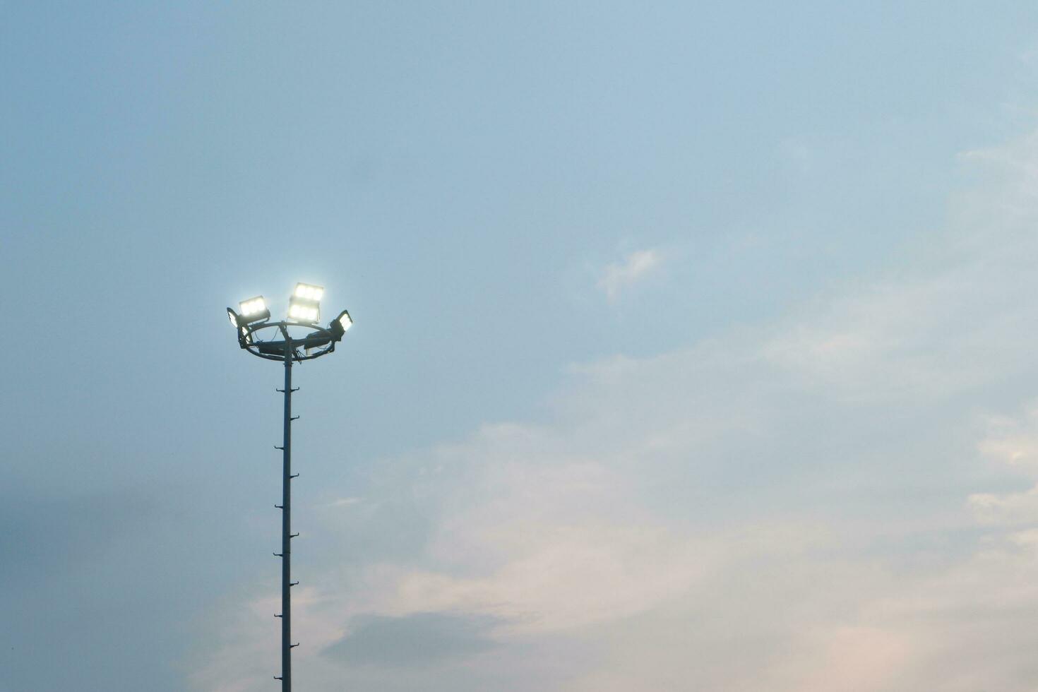 spotlight pole with blue sky and copy space photo