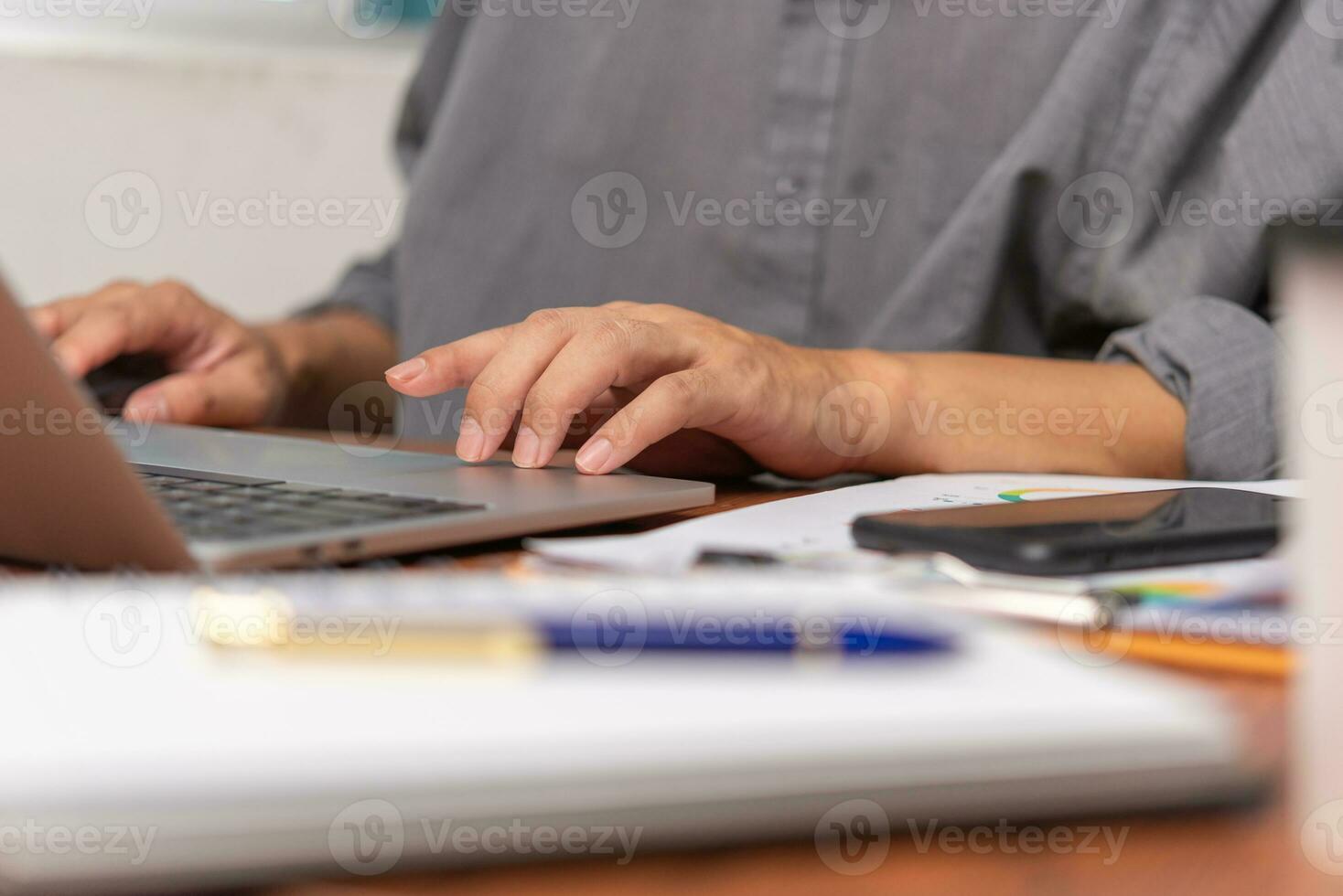 Businessman working laptop computer surfing the internet, communication online network search data Information technology digital. photo