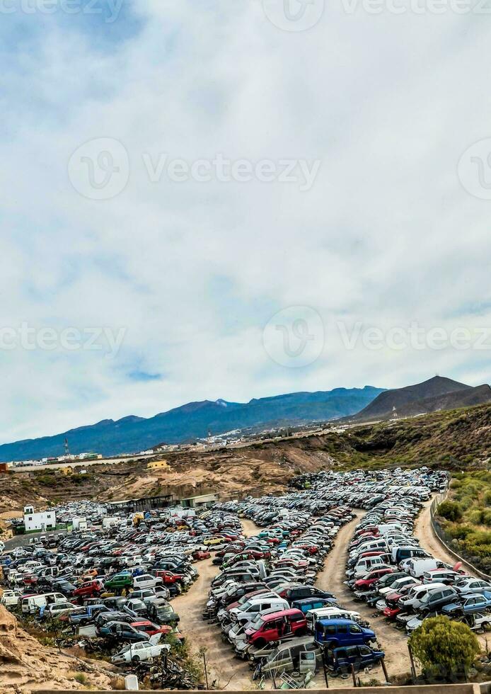 a parking lot full of cars in the desert photo