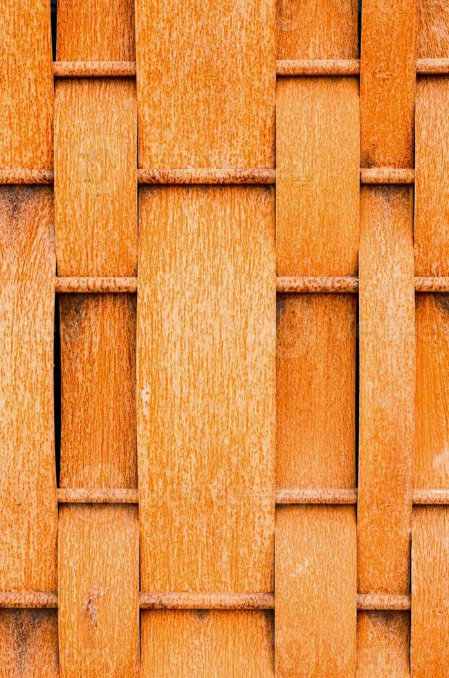 close up of a wooden fence with a pattern of squares photo