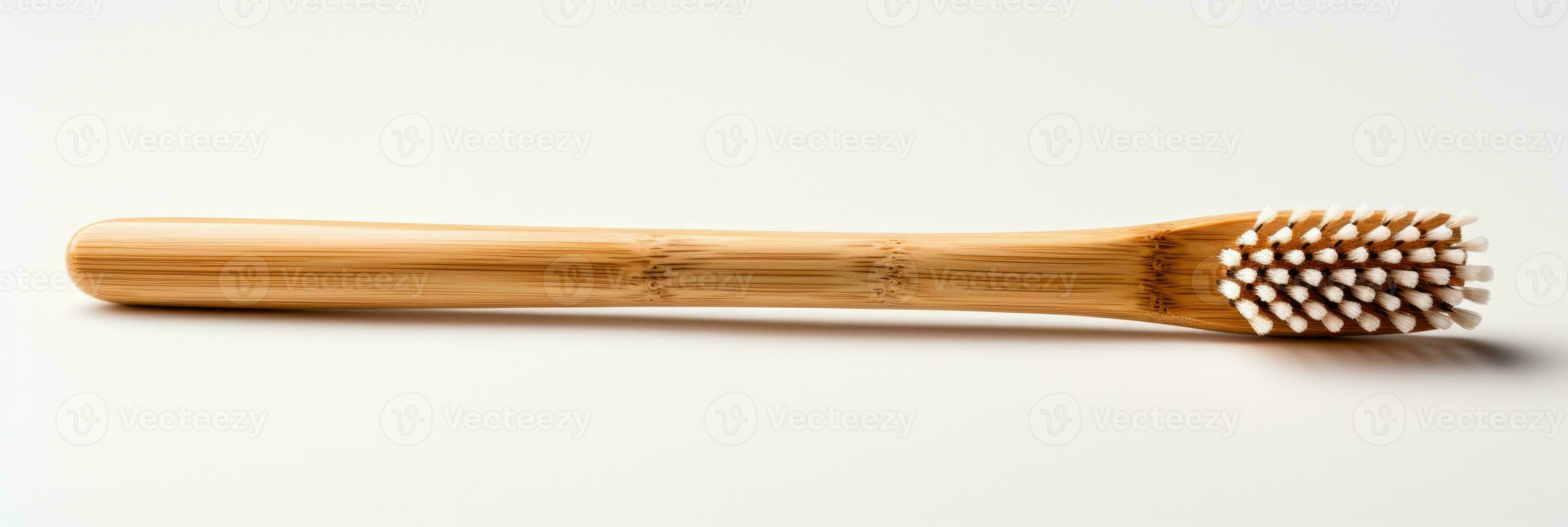 Reusable bamboo toothbrush focusing on sustainable choices isolated on a white background photo