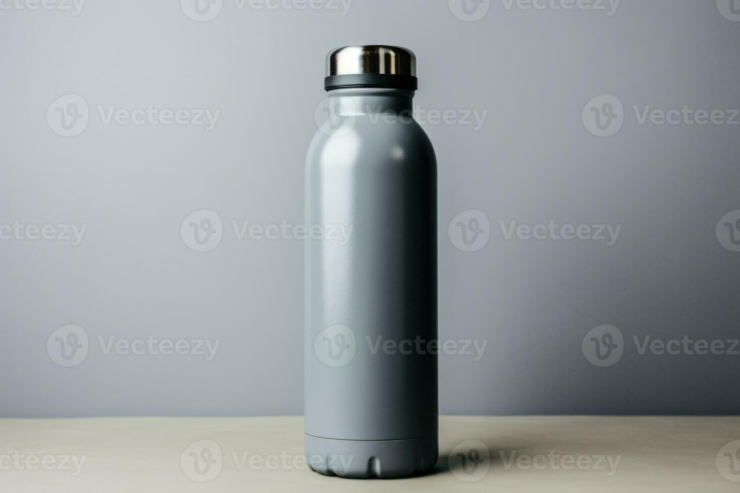 A reusable metal water bottle symbolizing sustainable travel isolated on a gray gradient background photo