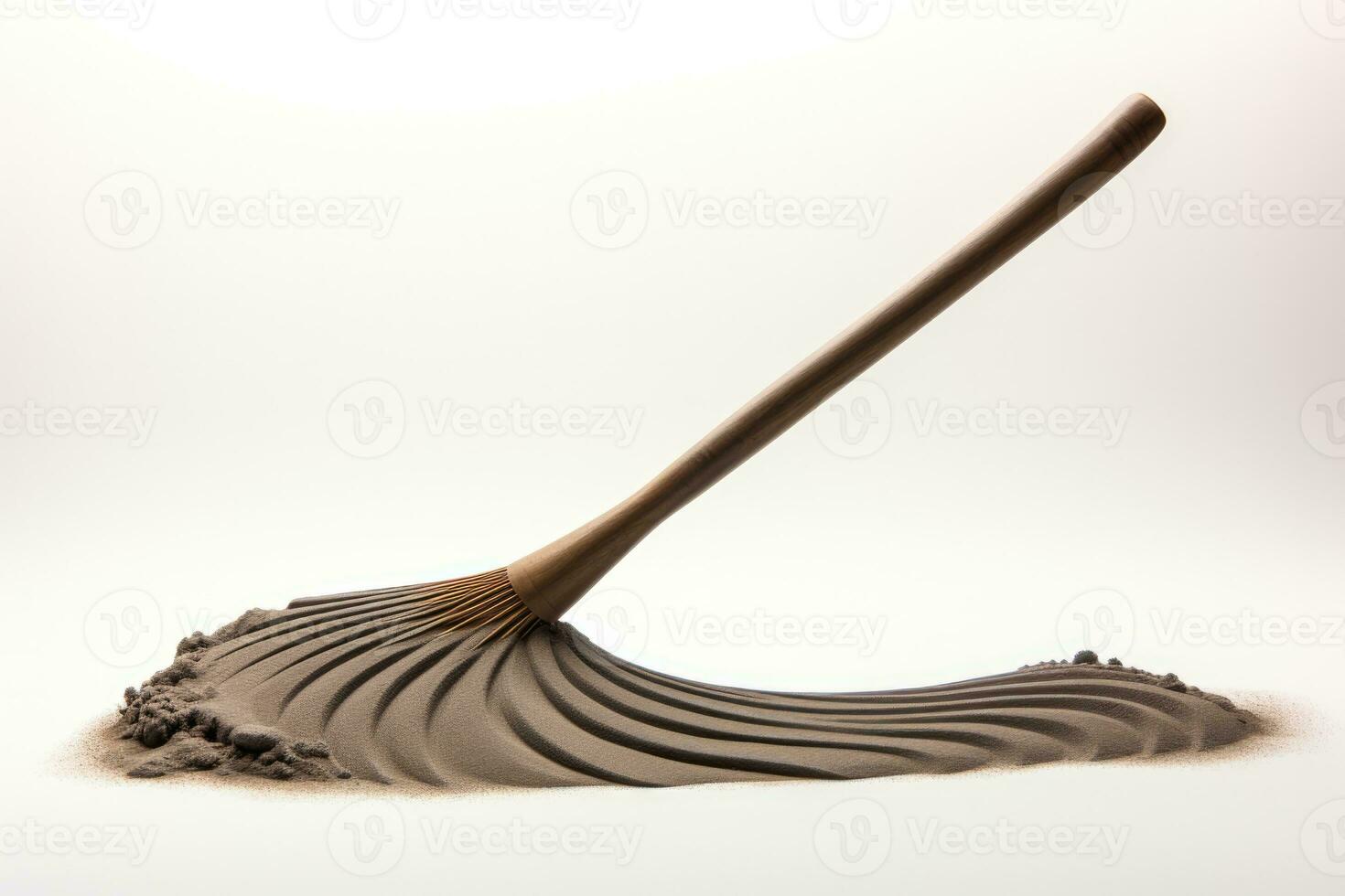 Simplicity represented by a single zen garden rake isolated on a white background photo