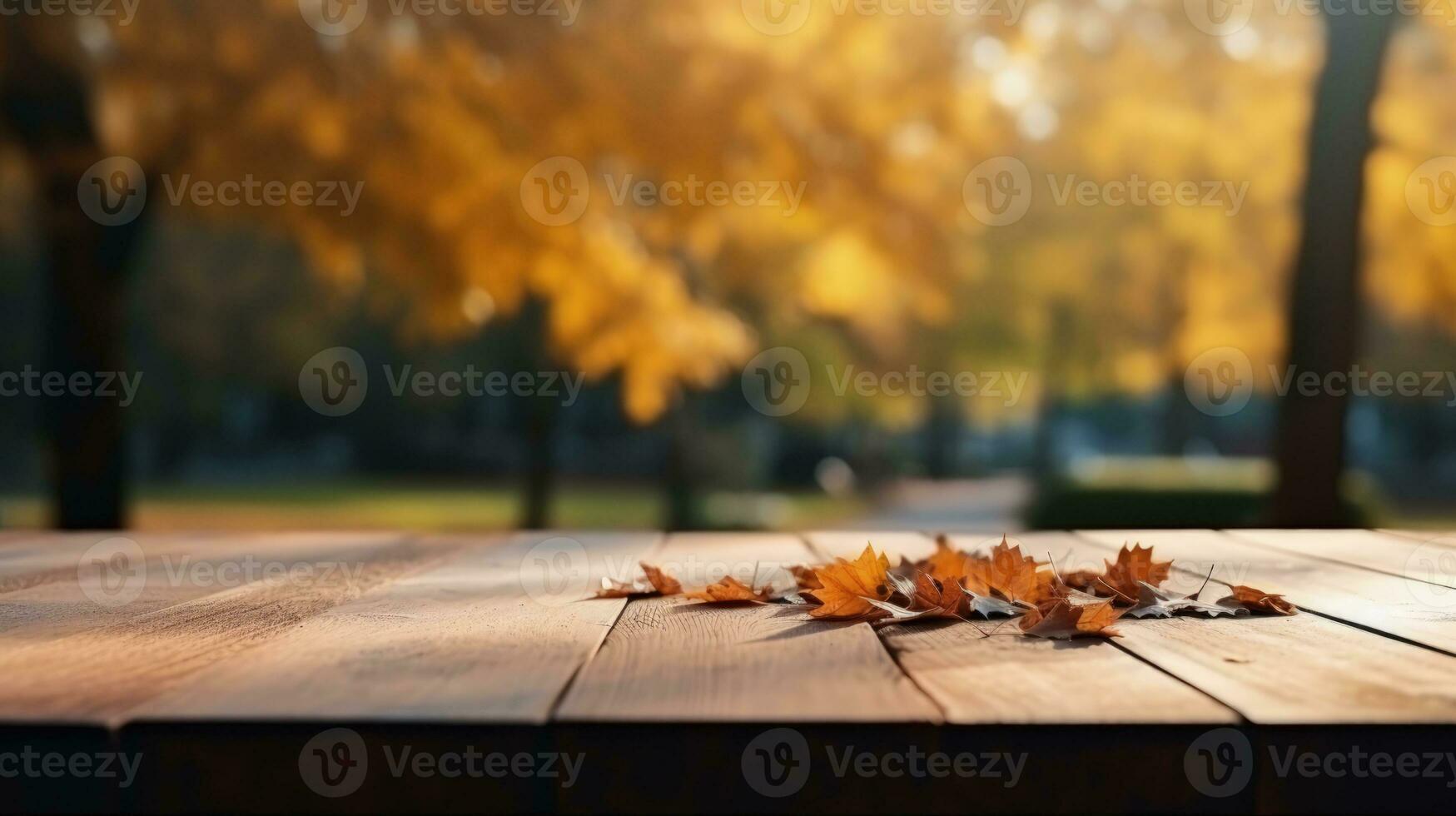 Wooden table with a background of an autumn park and falling leaves photo