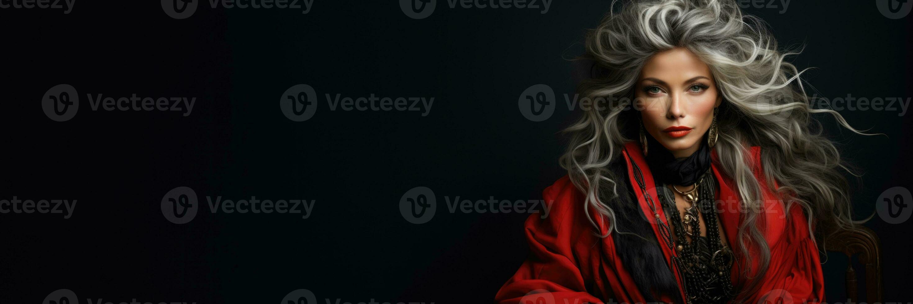 Elderly model owns silver tresses framed in rich charcoal shimmering silver and bold ruby photo