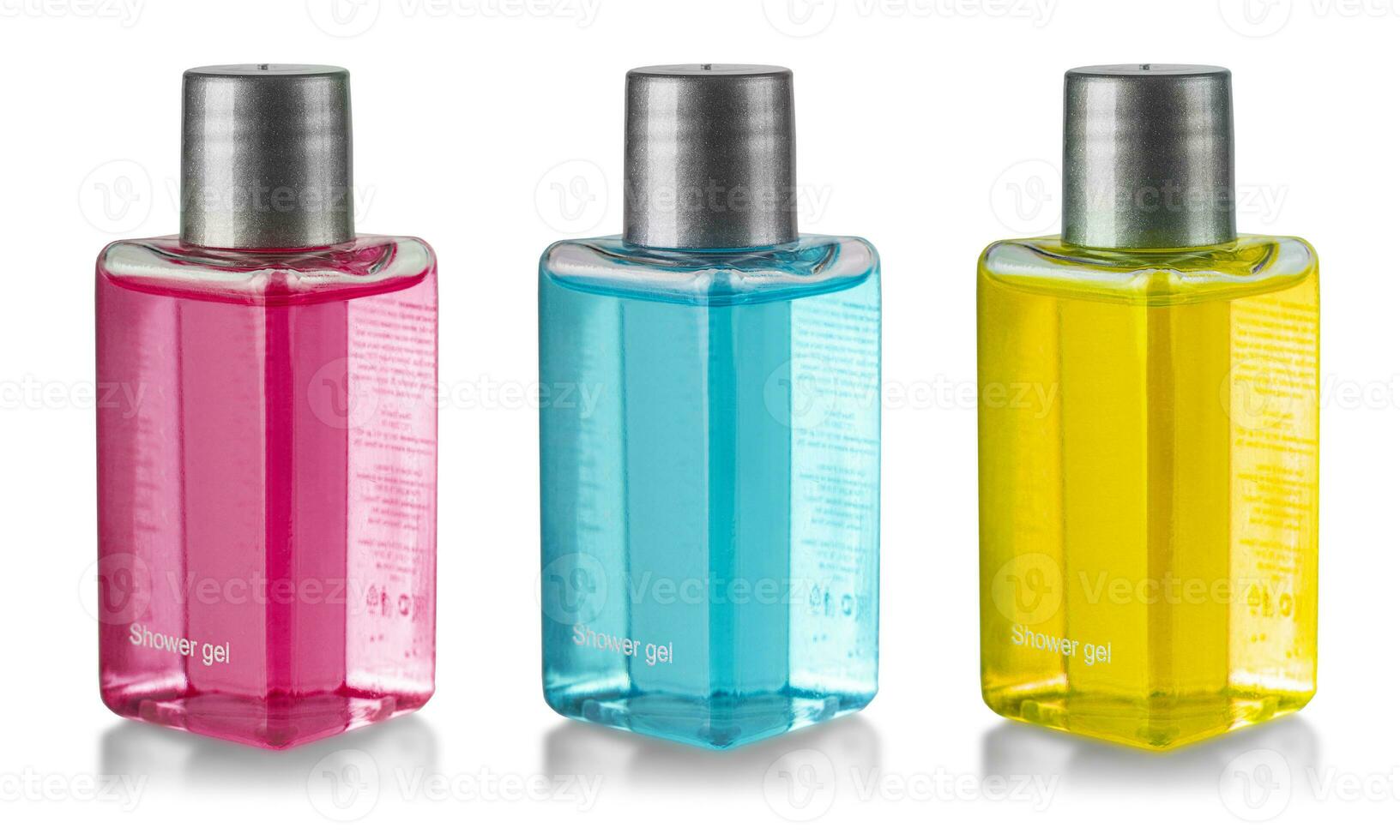 set of bottles with colored shower gel isolated on white background photo