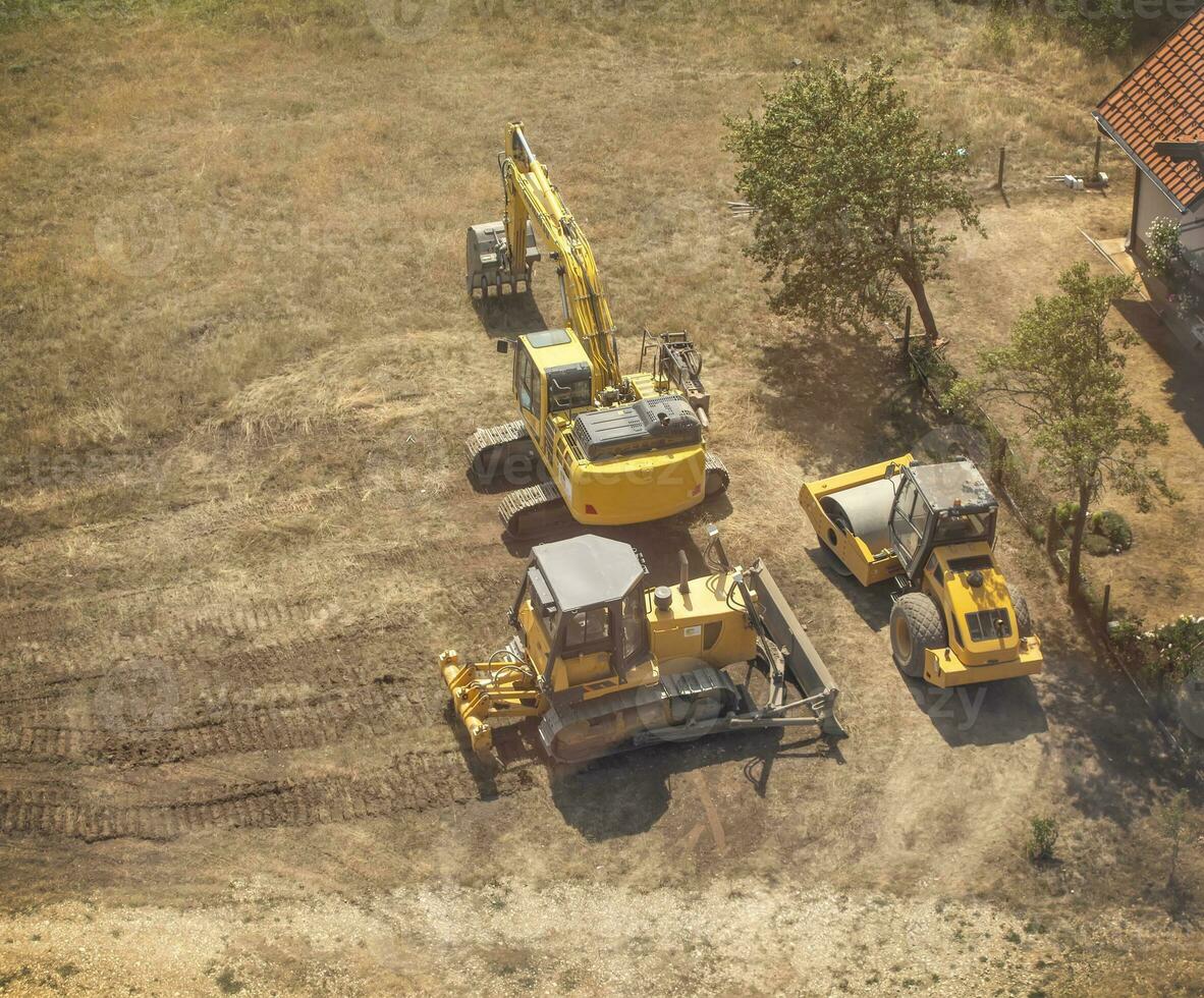 yellow tractors and excavators top view photo