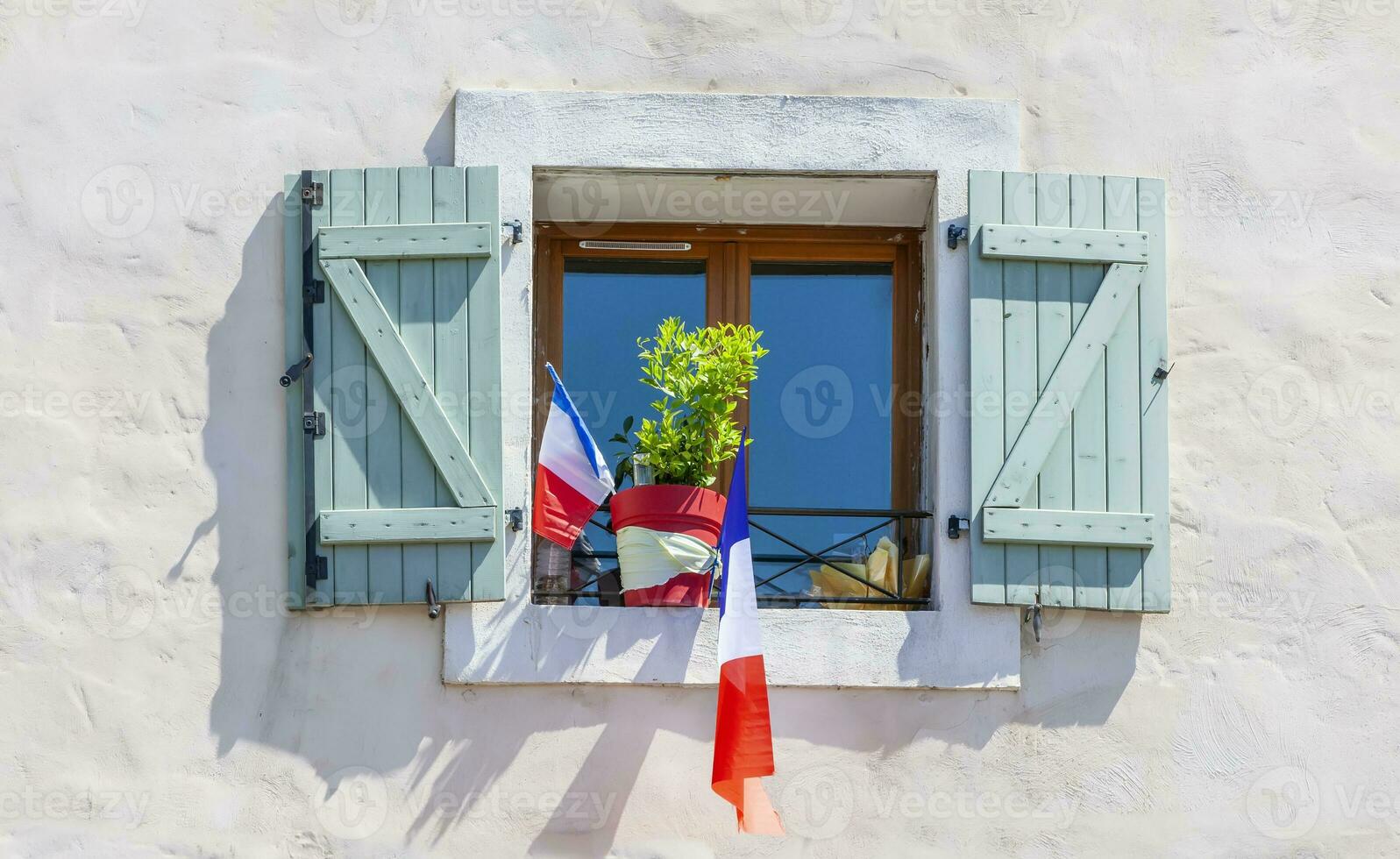 white building with national flag of france photo