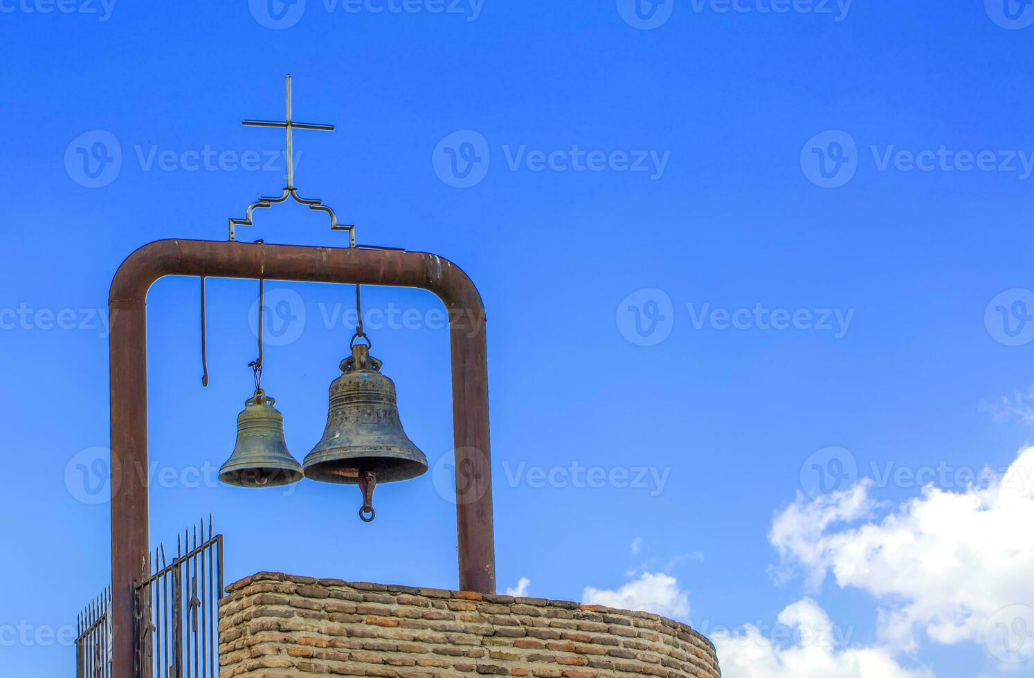 Orthodox bell tower and bell in the old church photo