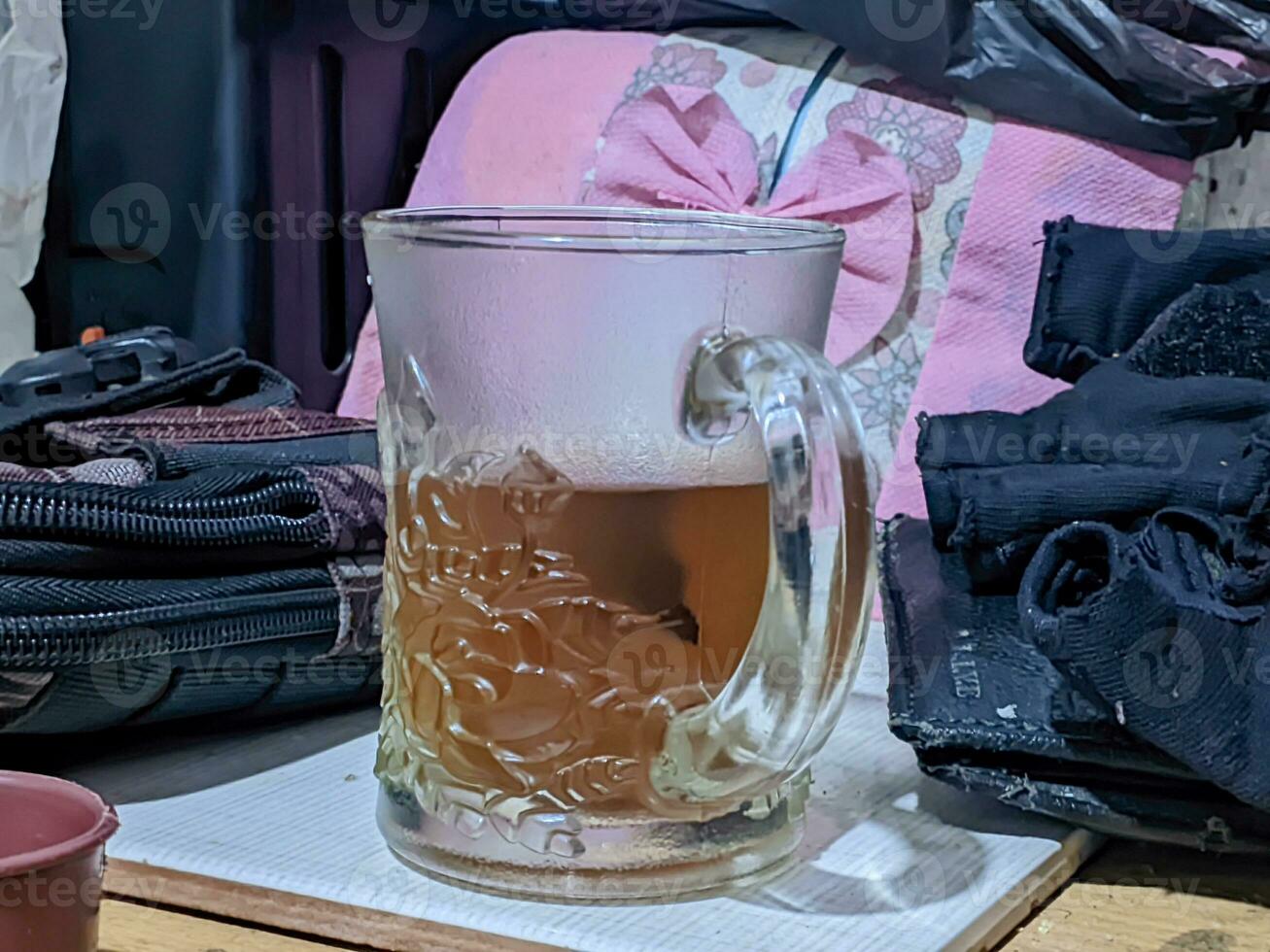 Glass mug of tea on wooden tableGlass mug of tea on wooden table photo