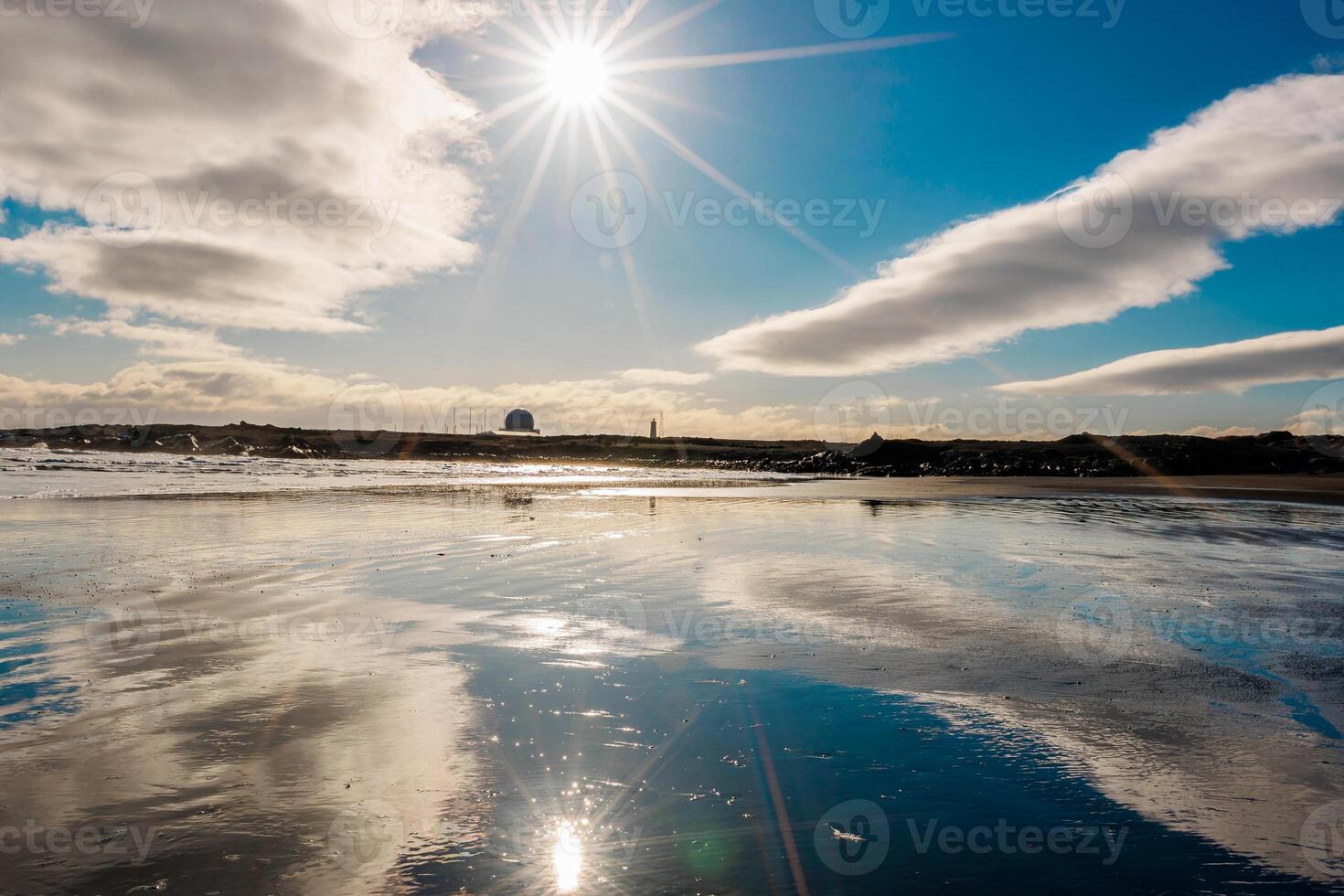 Former NATO military base in iceland near black sand beach, Keflavik air station used by defence organization within nordic roadside. Icelandic headquarters for alliance in Europe. photo