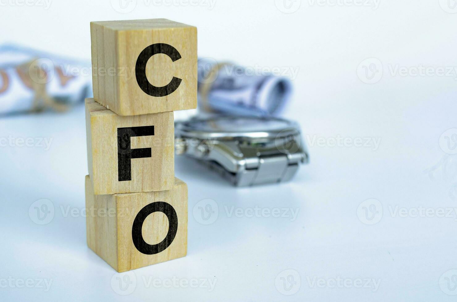 CFO text on wooden cubes representing Chief Financial Officer with customizable space for text. Copy space and Senior Management concept photo