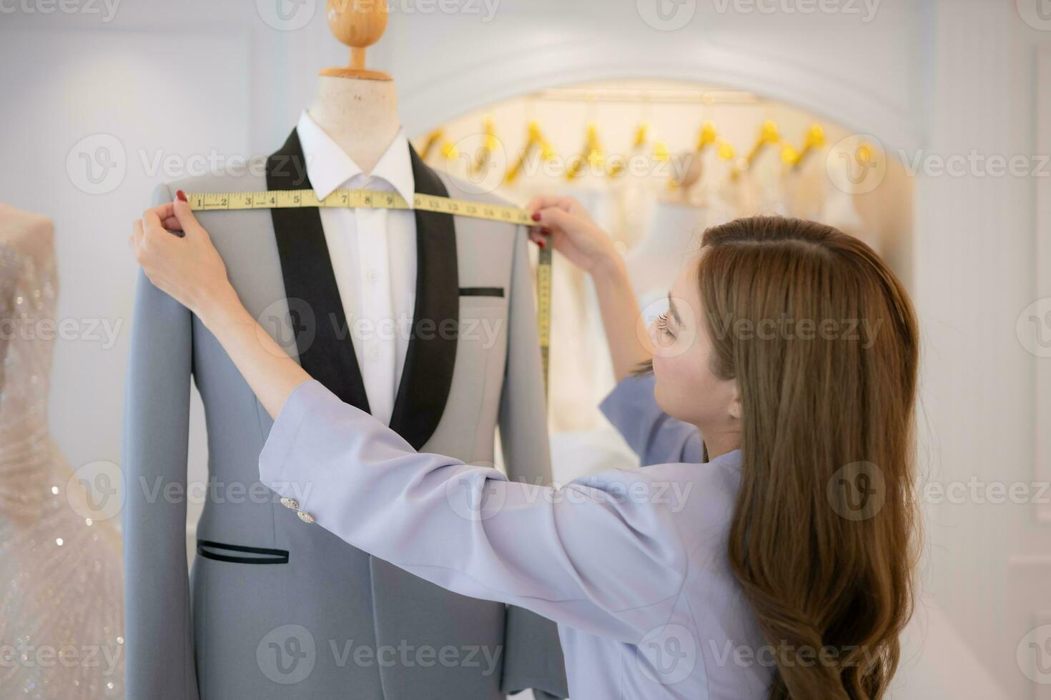 Asian fashion designers make sure the groom's outfit is absolutely accurate and ready for the bride and groom to try on. photo