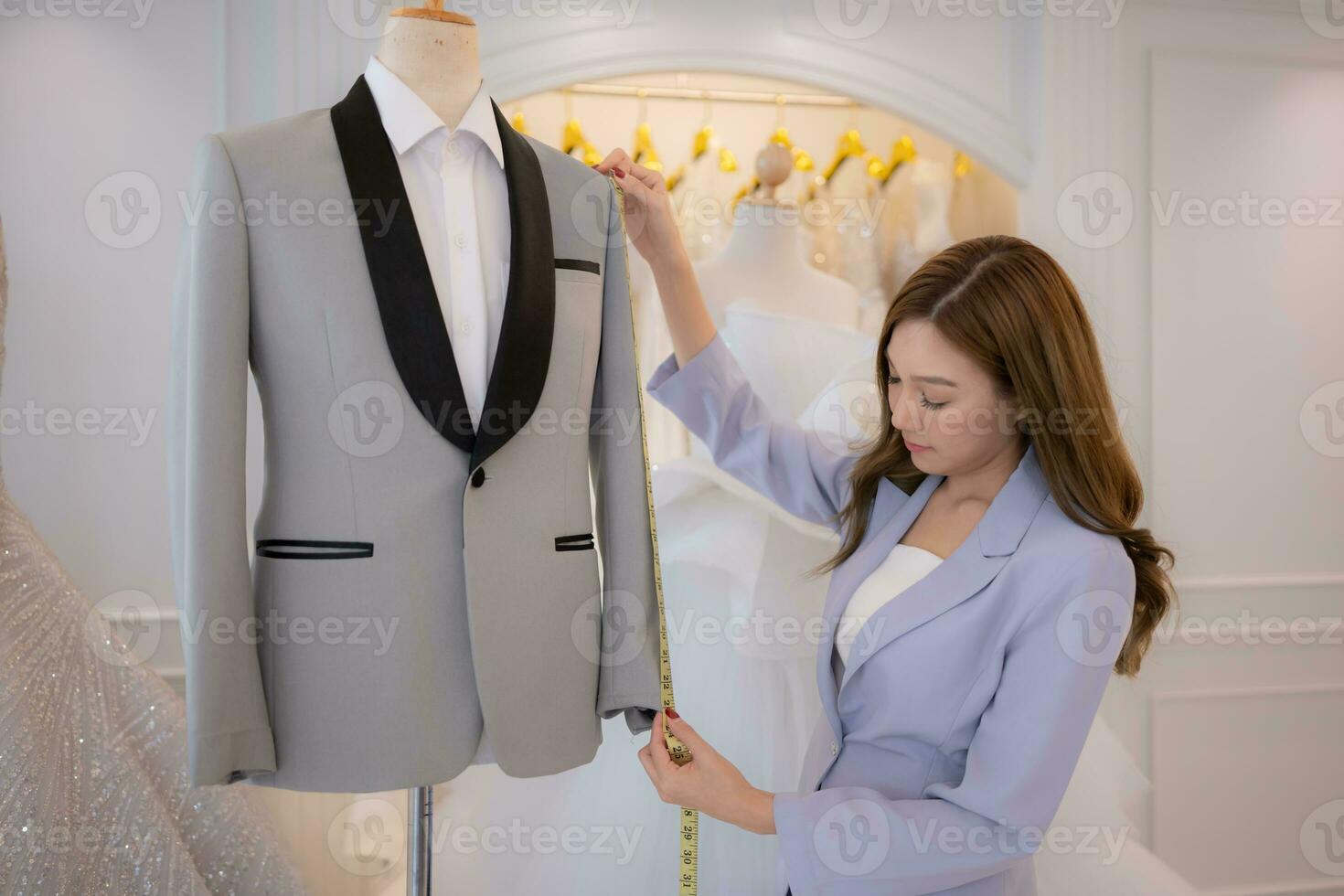 Asian fashion designers make sure the groom's outfit is absolutely accurate and ready for the bride and groom to try on. photo