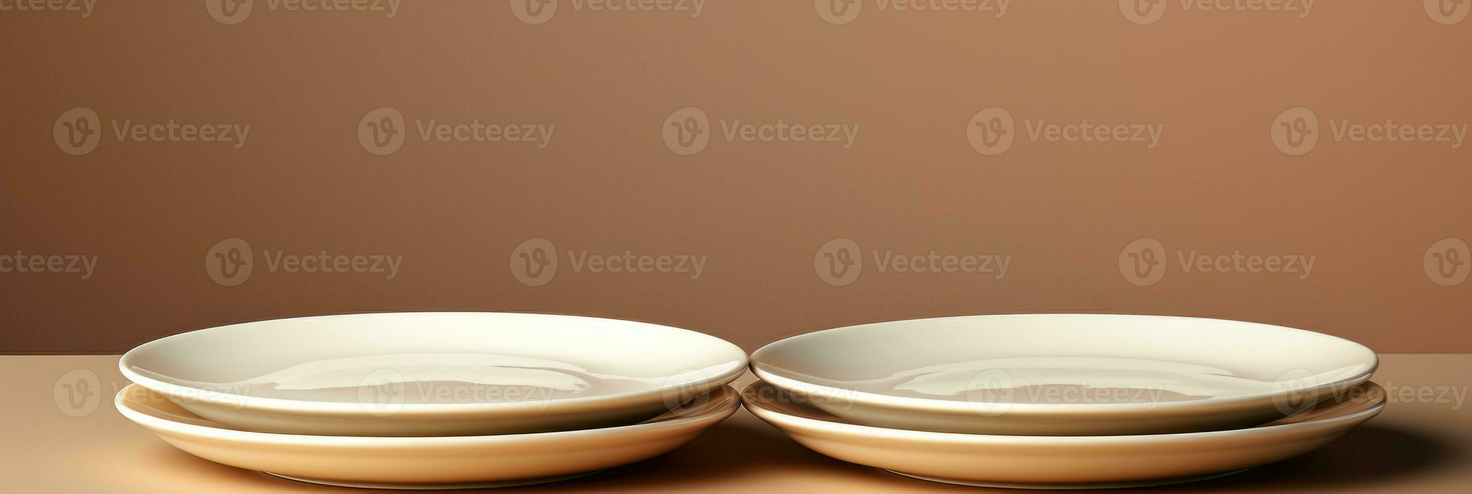 A chic set of minimalistic porcelain dining plates isolated on a taupe gradient background photo