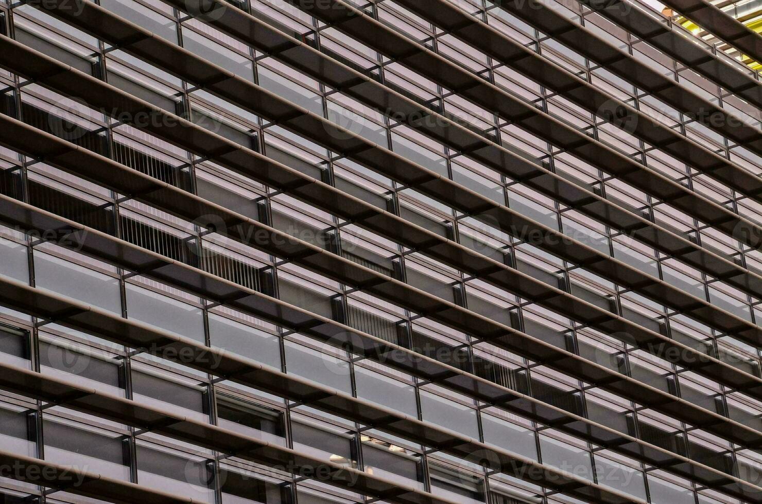 a building with many windows and a clock on it photo