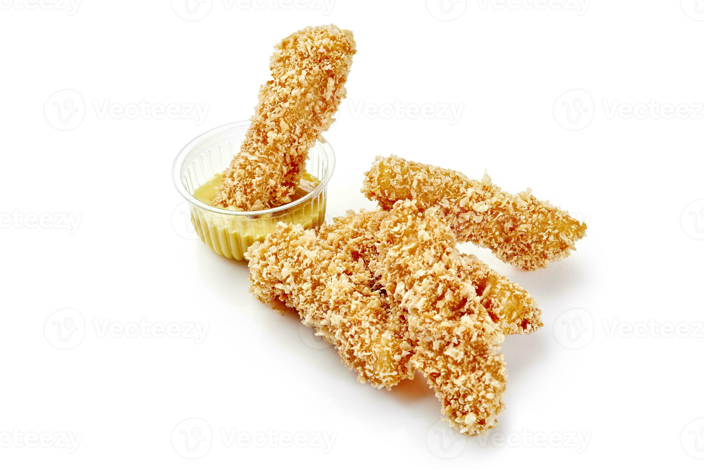 Deepfried breaded chicken strips with honey mustard sauce 34340047