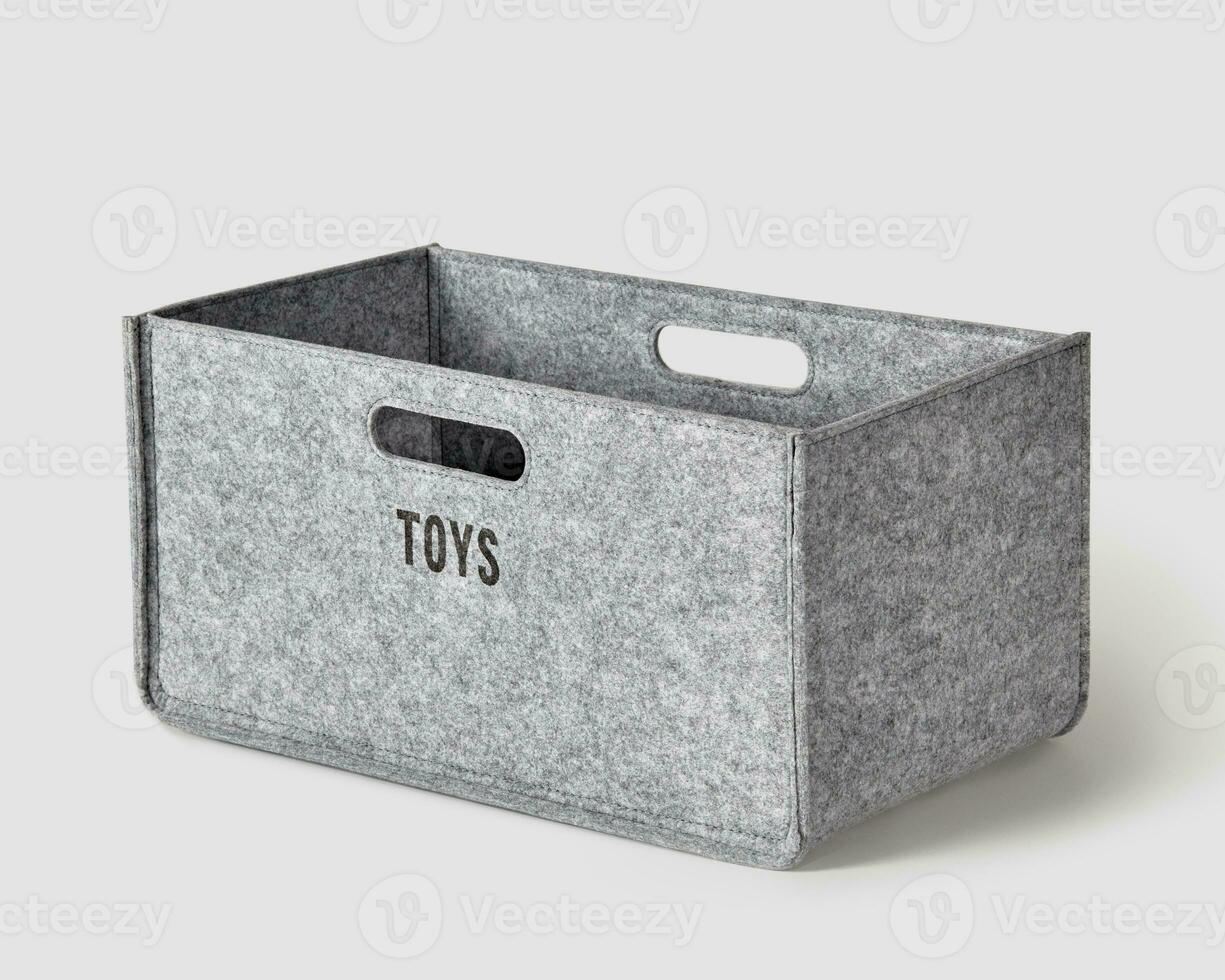 Handcrafted gray felt box with handles for storing toys photo