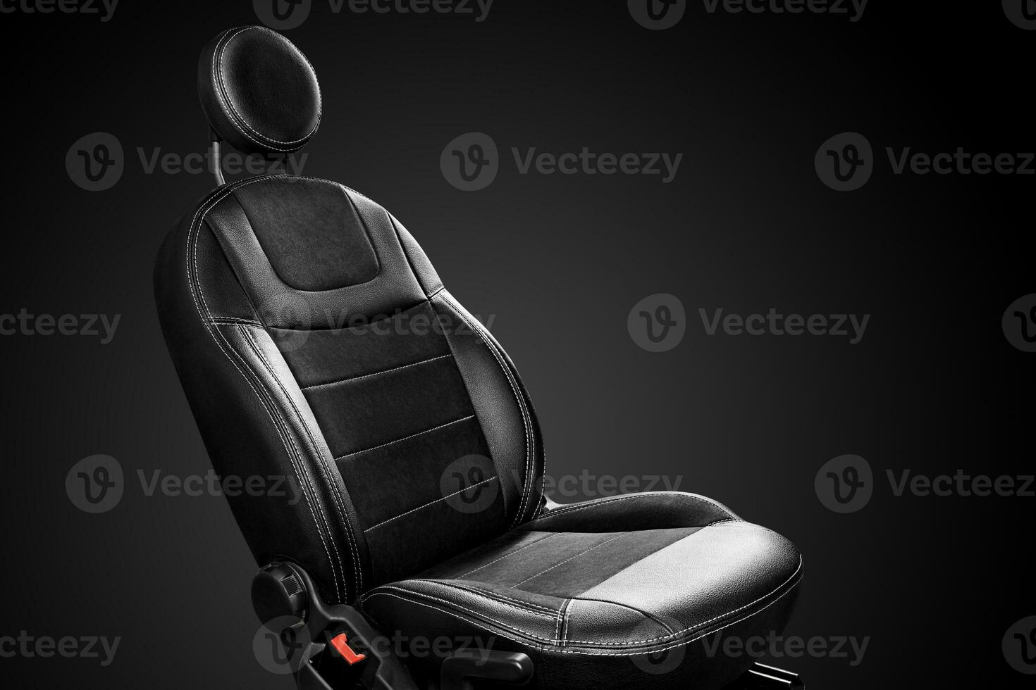 Ergonomic driver car seat with round headrest isolated on black background photo