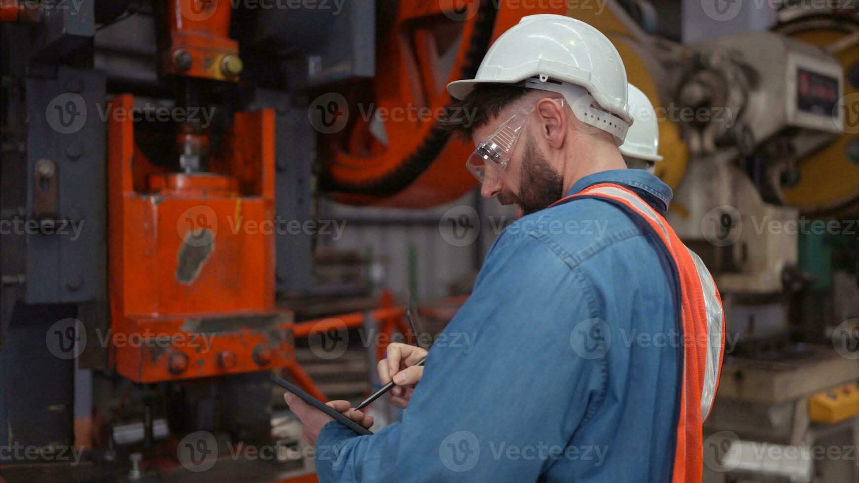 Engineer and technician discussing machinery in factory to plan inspection maintenance according to usage cycle, Concepts inspections based on usage cycle maintenance photo