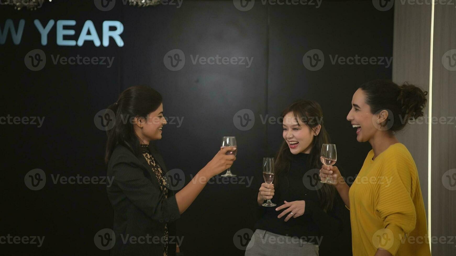 New Year party, Group of young people clinking glasses with champagne at a New Year's Eve party. photo