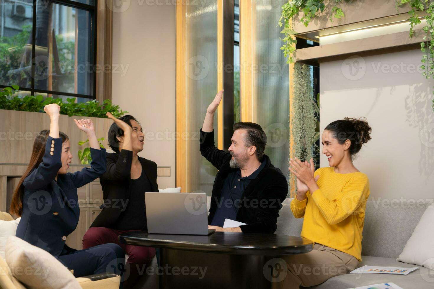 Businessman and businesswoman discussing a project in the meeting room of co-working space photo