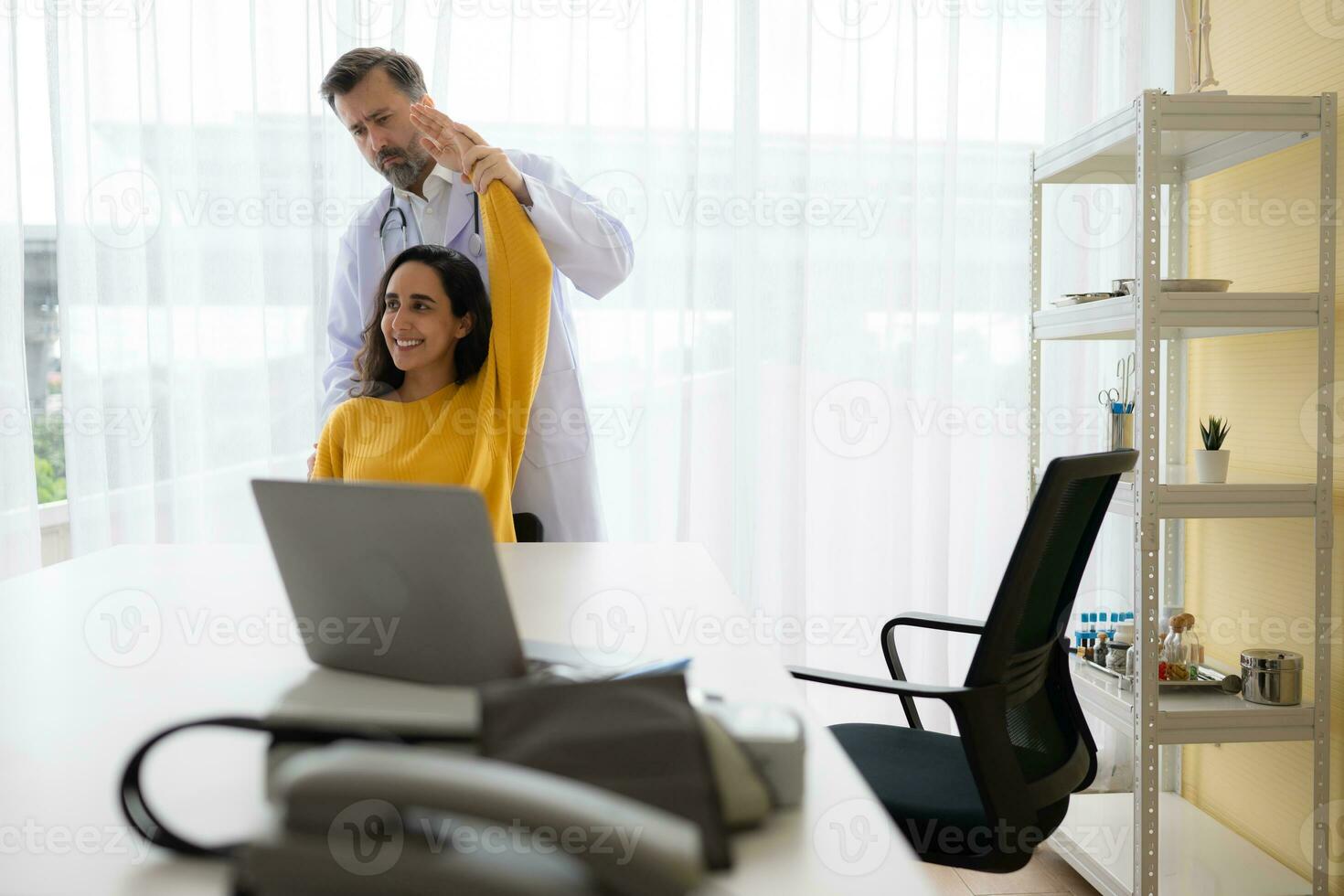 The doctor is examining the patient's arm and upper arm area to assess treatment. Medical and healthcare concept photo