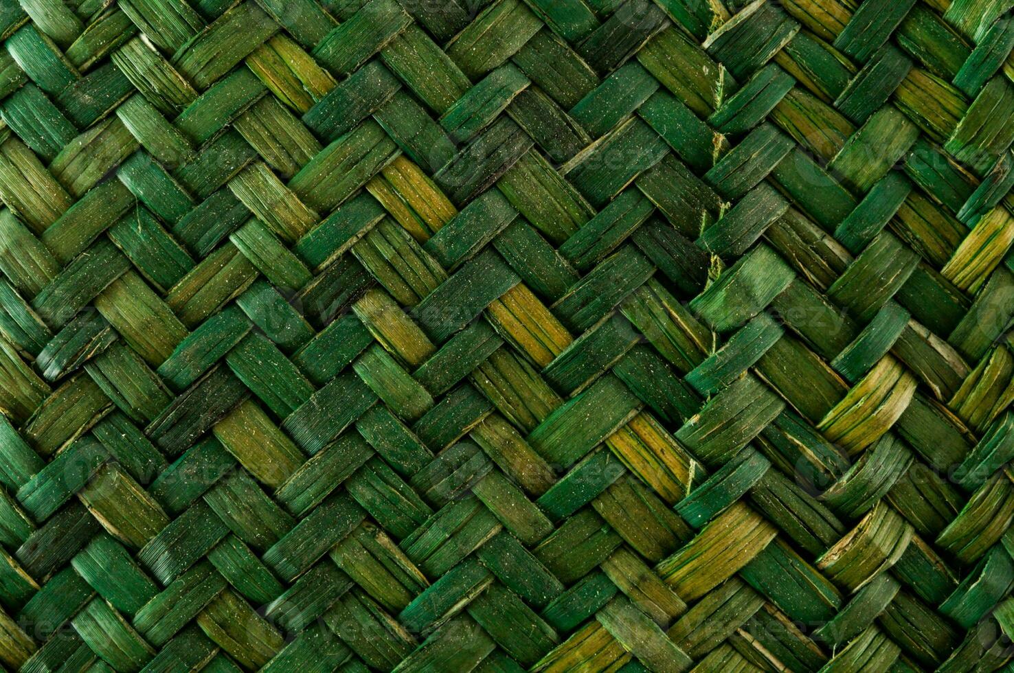 a close up of a woven basket with green and yellow photo