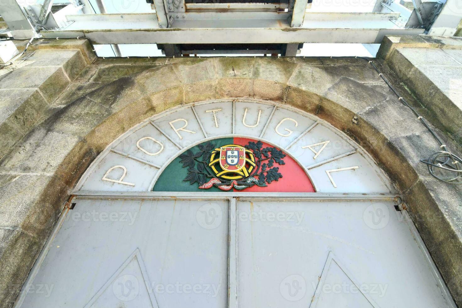 a door with a sign that says portugal on it photo