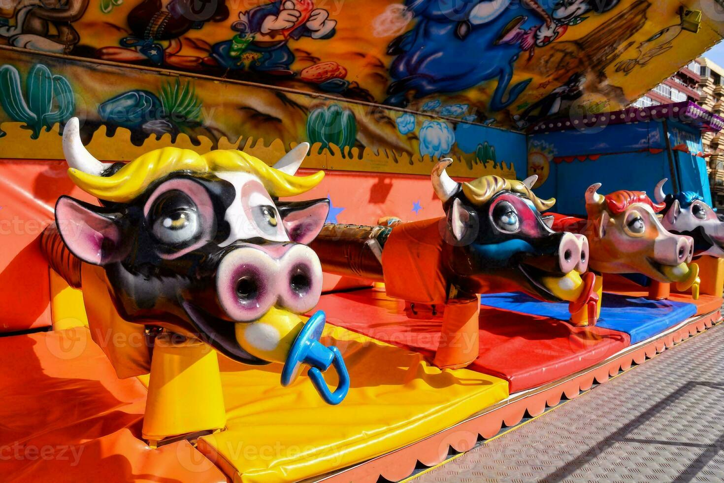 a carnival game with cow heads on it photo