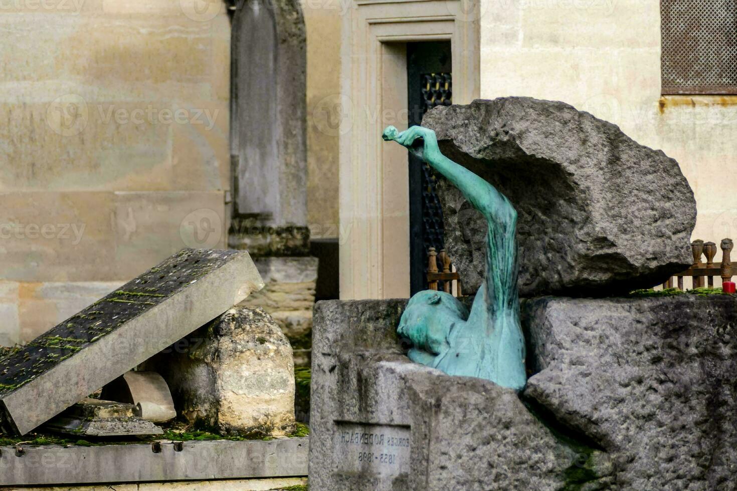 a statue of a man in a rock formation photo