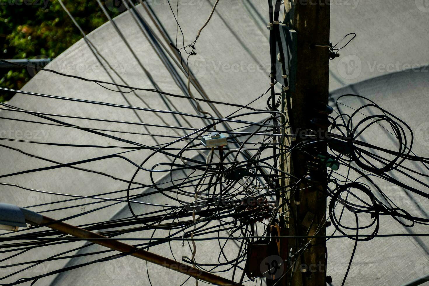 a large number of wires are connected to a pole photo