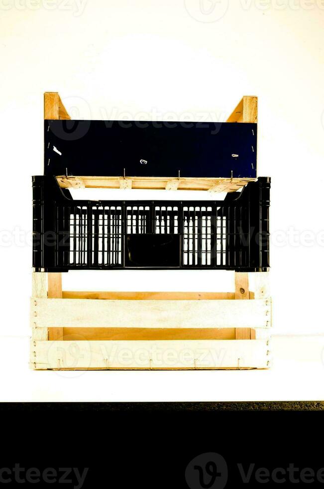 a wooden crate with a blue top and black bottom photo