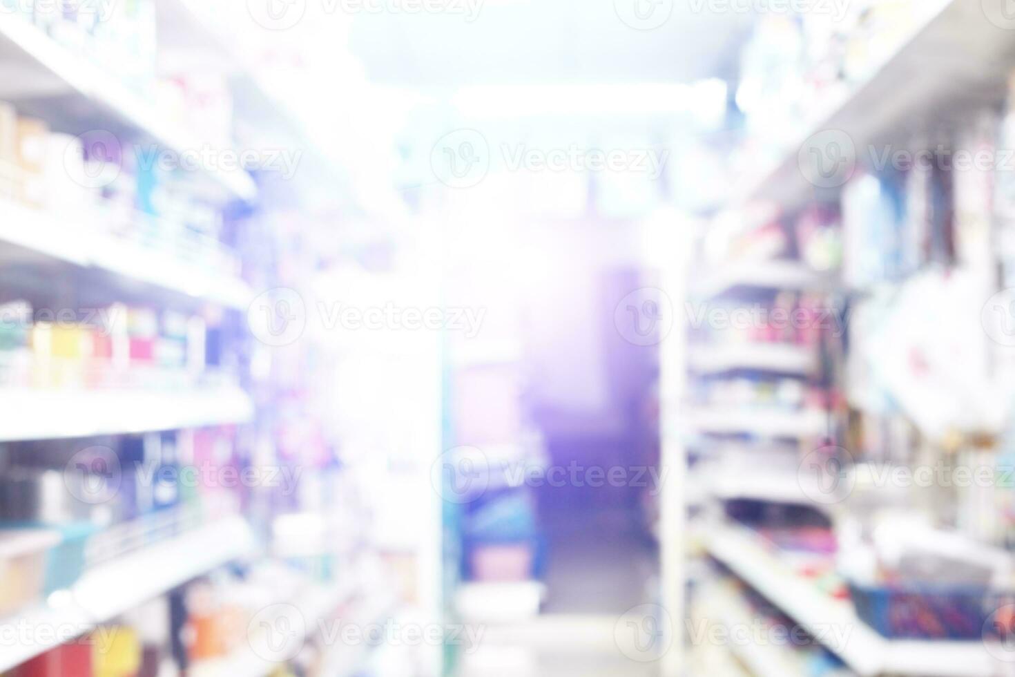 Abstract blurred background of stationery and crafts retail shop show aisle , many products and shelves photo