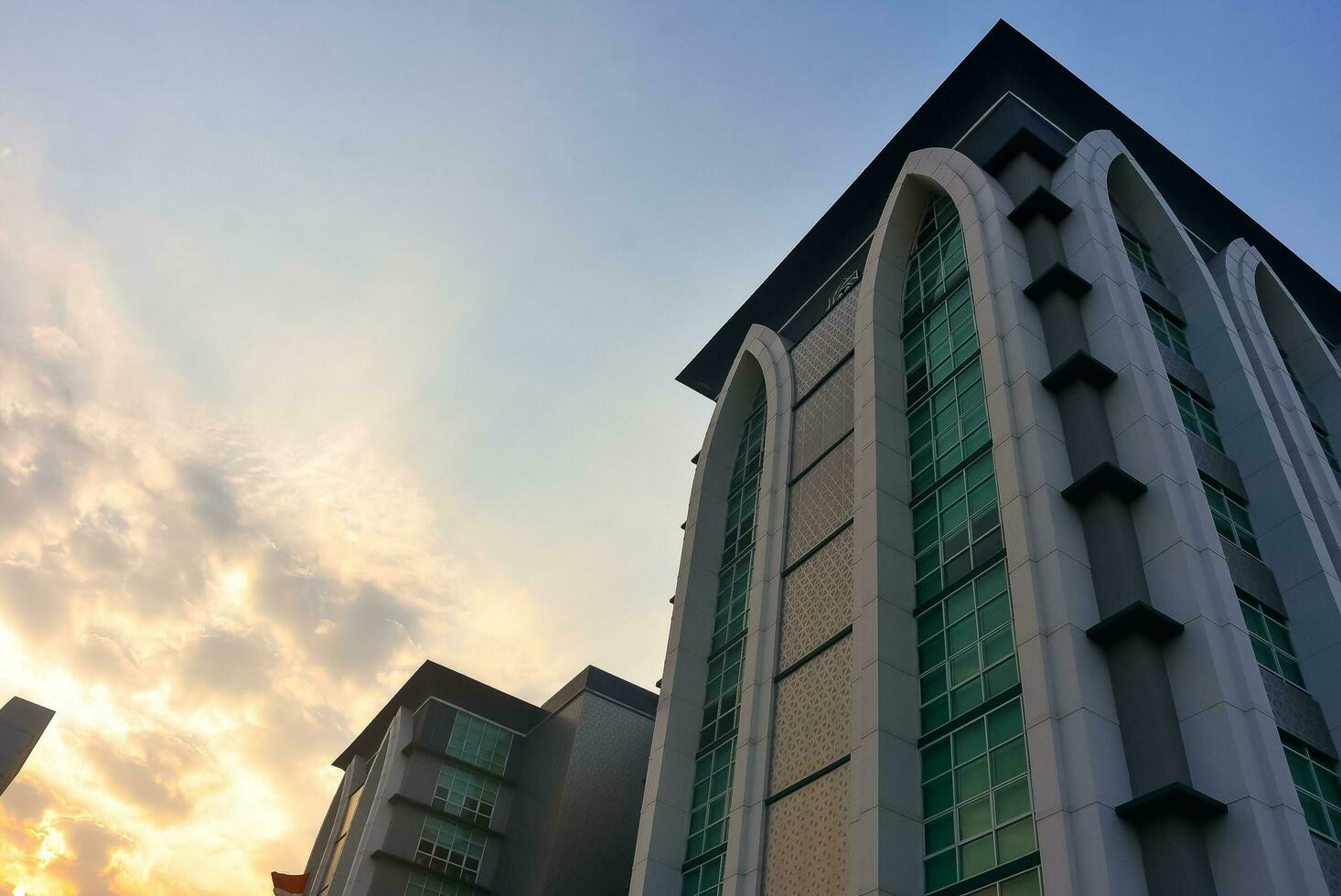 Surabaya, Indonesia - 08-15-2023. amazing sunset view in one of the main buildings at Sunan Ampel State Islamic University UIN, faculty of adab and humanities. photo