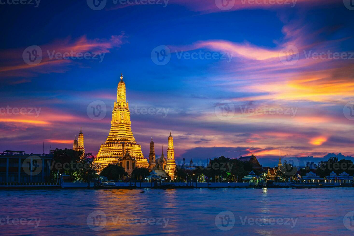 Wat Arun by Chao Phraya River in Bangkok, thailand at night photo