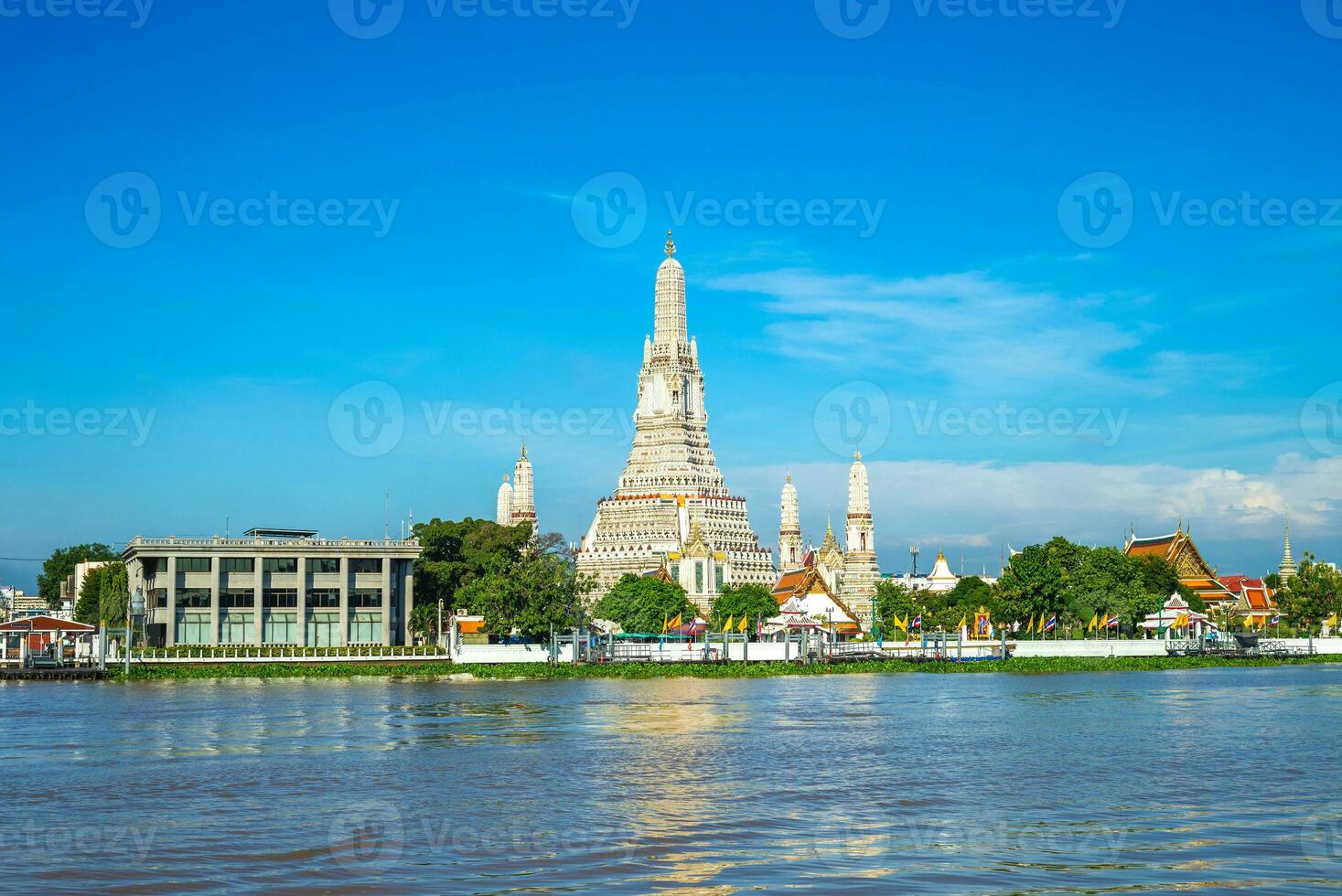 Wat Arun at the bank of Chao Phraya River in Bangkok, thailand photo