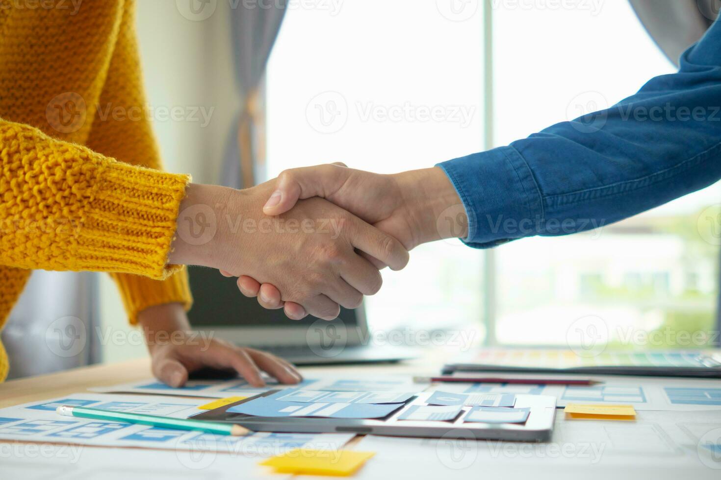 The designer team is designing the uxui system to make the uxui system work well on new phones and support system updates. Website development concept UI UX front end designer photo