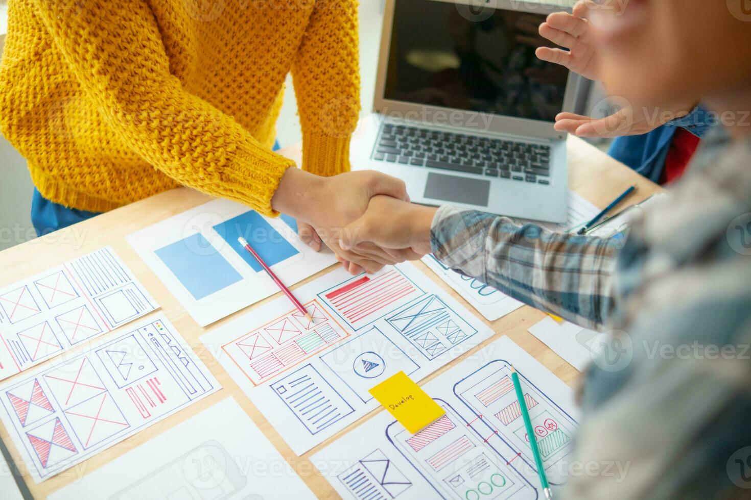 The designer team is designing the uxui system to make the uxui system work well on new phones and support system updates. Website development concept UI UX front end designer photo