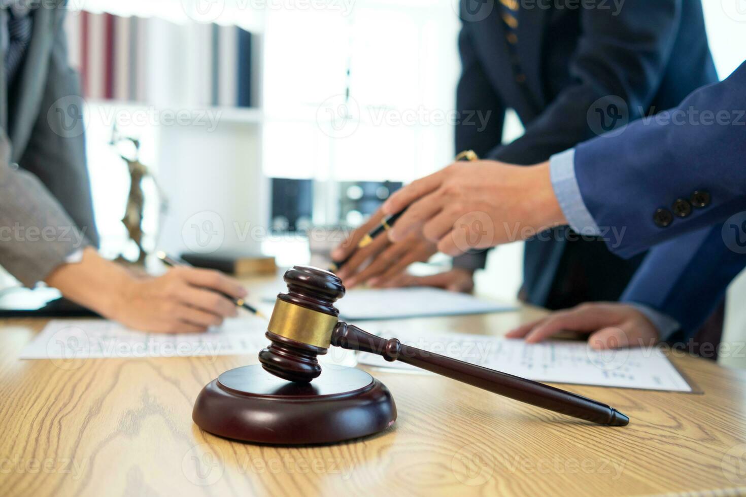 judge's gavel in law office is placed on table to symbolize judge deciding lawsuit. gavel wood on wooden table of lawyers in legal advice office as symbol of fair judgment in cases. photo