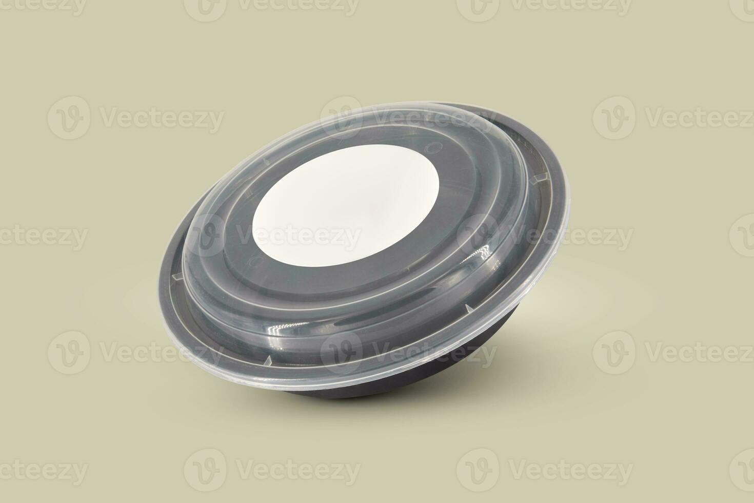 Black plastic food containers with transparent lid and white cardboard label photo