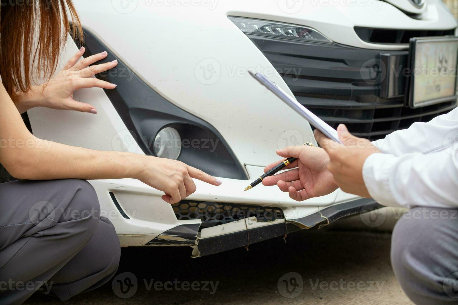 Insurance agents meet with customers when accidents occur to inspect damage and document insurance claims expeditiously. concept of car insurance agents to urgently inspect damage for customers. photo